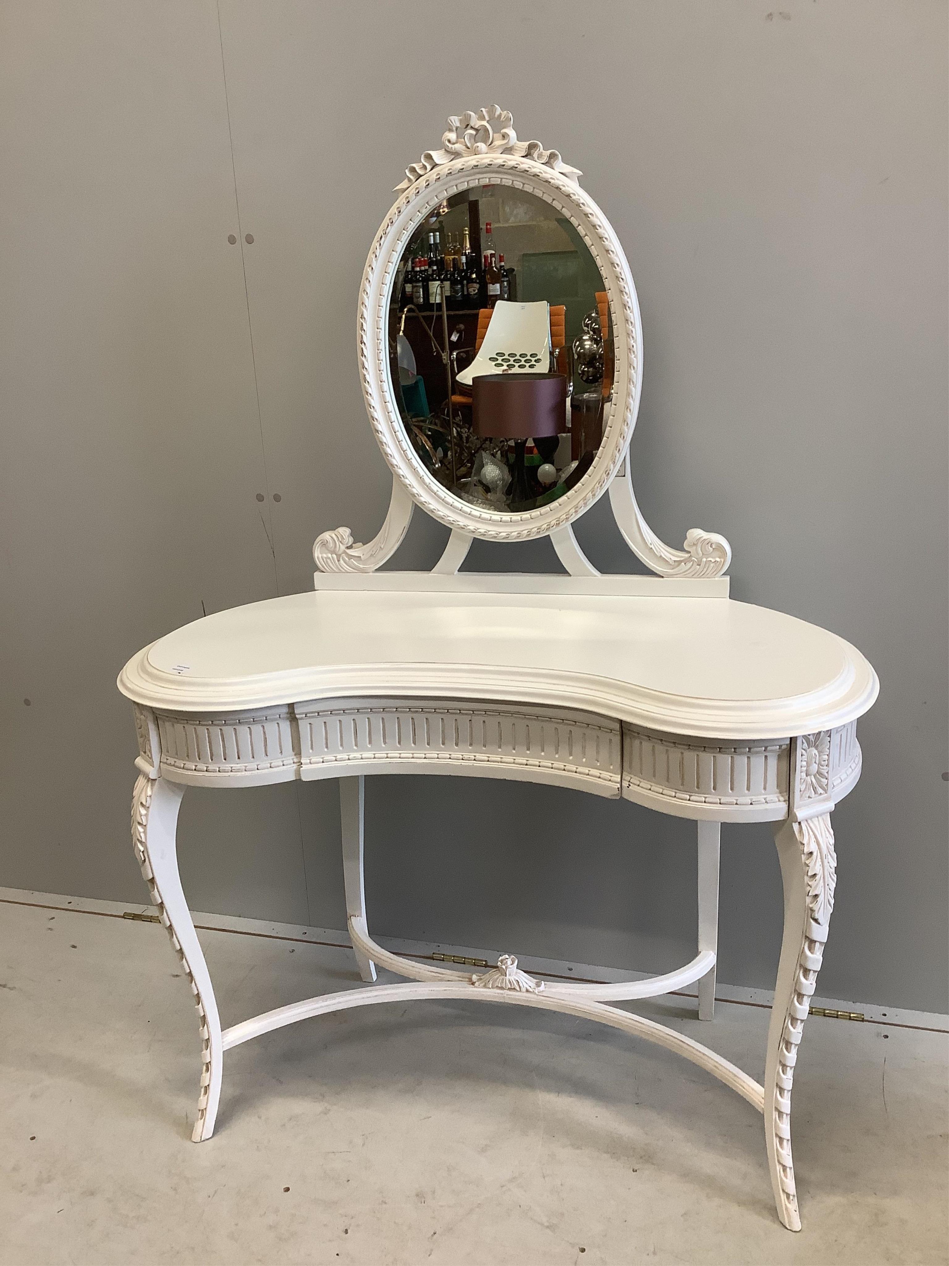 A modern Victorian style white painted kidney shaped dressing table, width 104cm, depth 48cm, height 146cm and a stool. Condition - good